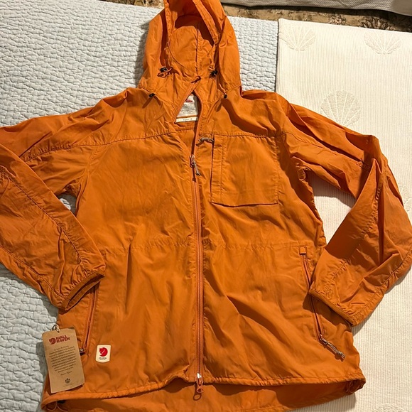 Fjallraven Jackets & Blazers - Fjallraven rain/wind jacket, 2way zip, and hood. Pull cords for a secure fit.